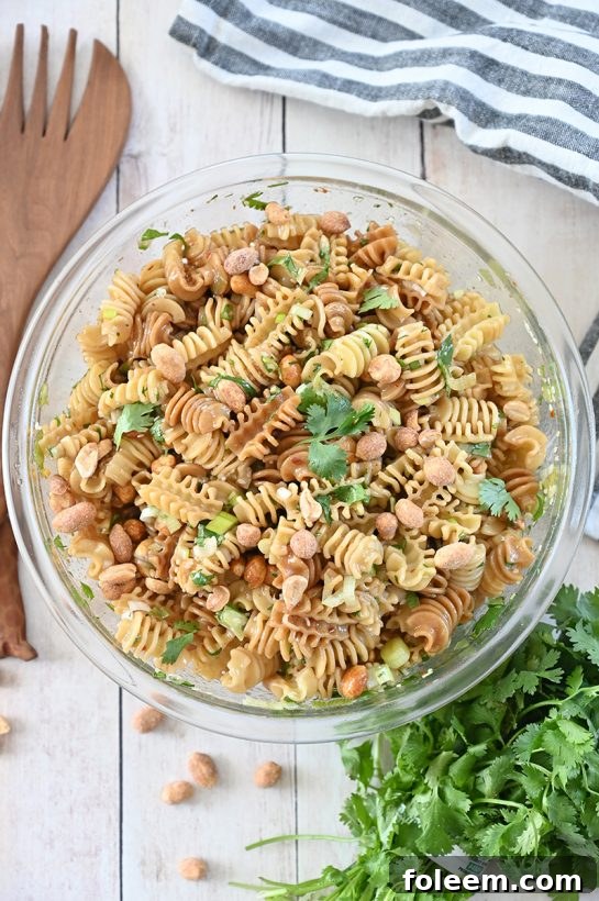Amazing and easy Sesame Pasta Salad recipe: pasta tossed in a sesame oil and soy sauce-based dressing is a refreshing, Asian-inspired side dish perfect for summer picnics, BBQ, or potlucks!