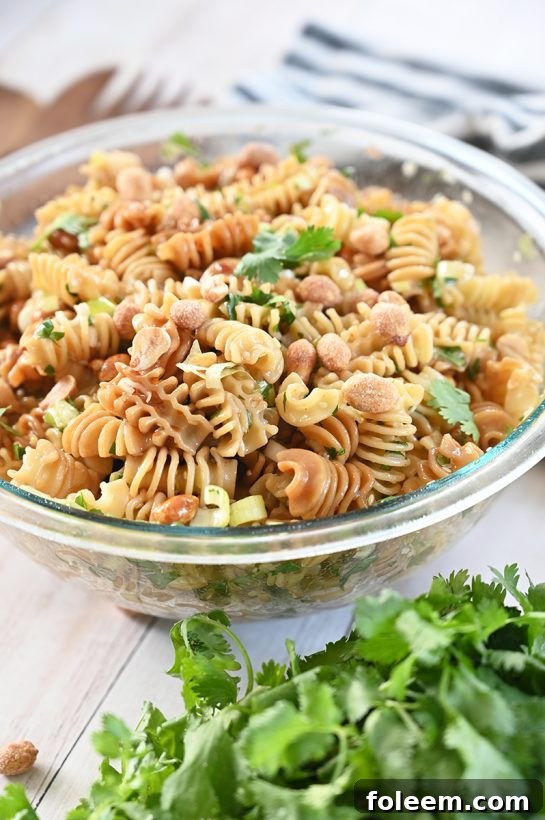 Tasty and easy Sesame Pasta Salad recipe: pasta tossed in a sesame oil and soy sauce-based dressing is a refreshing, Asian-inspired side dish perfect for summer picnics, BBQ, or potlucks!