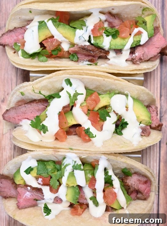 Easy Grilled Flank Steak Tacos with Avocado and Cilantro Lime Crema, perfect for any day of the week.