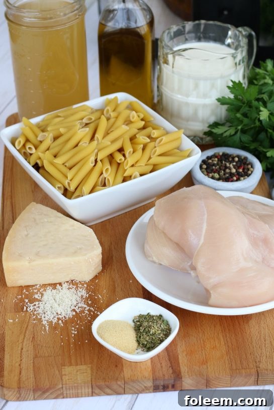 Ingredients for chicken alfredo with pasta, can be made in a slow cooker or on the stove-top.