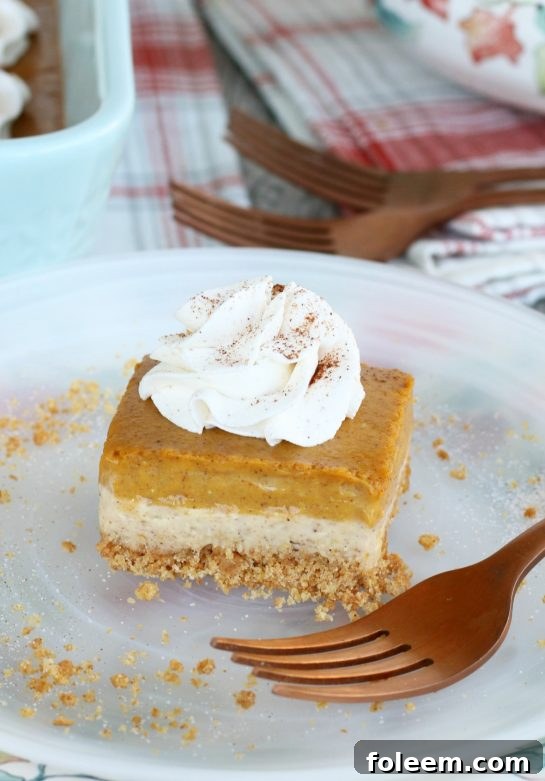This amazing pumpkin cheesecake bars recipe has buttery graham cracker crust, a cream cheese layer and a pumpkin cream cheese layer! A great, easy fall dessert idea!