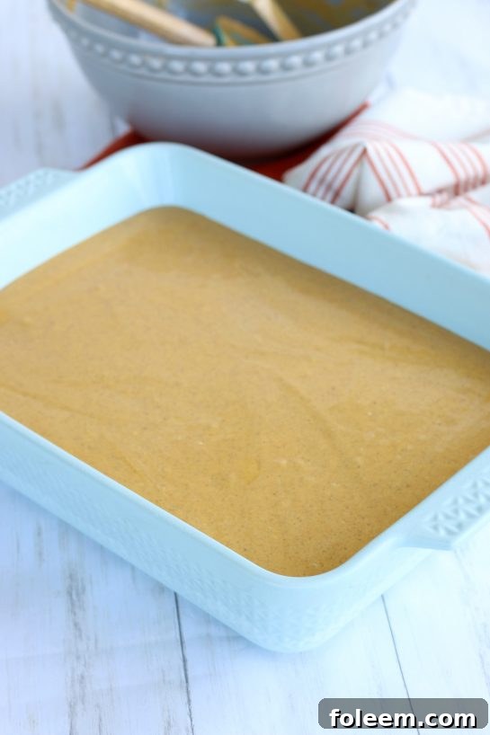 Pumpkin cream cheese layer added to finish the Pumpkin Cream Cheese Bars