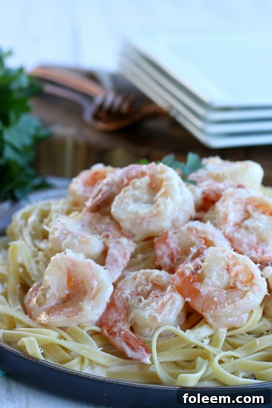 Close up of the finished garlic butter shrimp with garlic butter sauce plated and ready to eat.