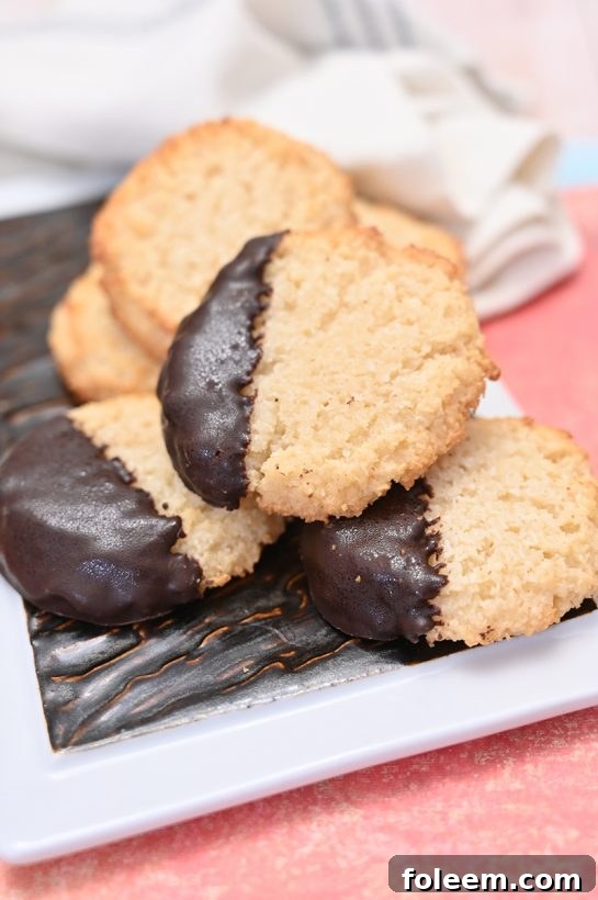 Beautifully arranged Italian Chocolate Dipped Coconut Macaroons, perfect for a holiday dessert table.