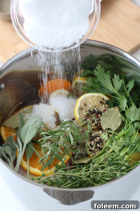 A close-up of a bowl filled with kosher salt, a key ingredient for a successful turkey brine.