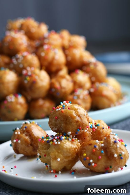 A close up shot of a serving of the struffoli on a plate ready to eat.