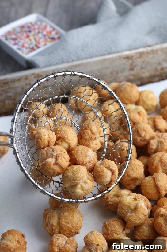 A top down shot of the finished struffoli recipe, perfectly brown and ready to be enjoyed.