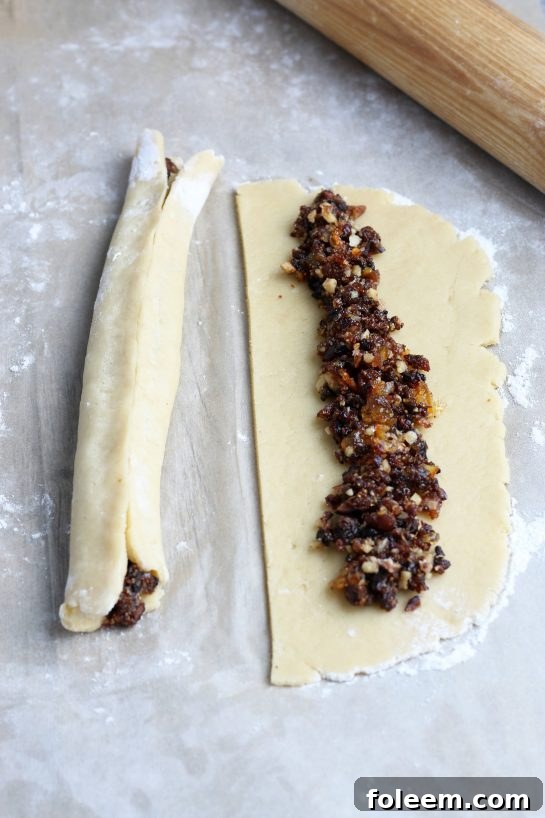 Here you can see the rolling process of closing up the outer cookie shell around the fig filling.