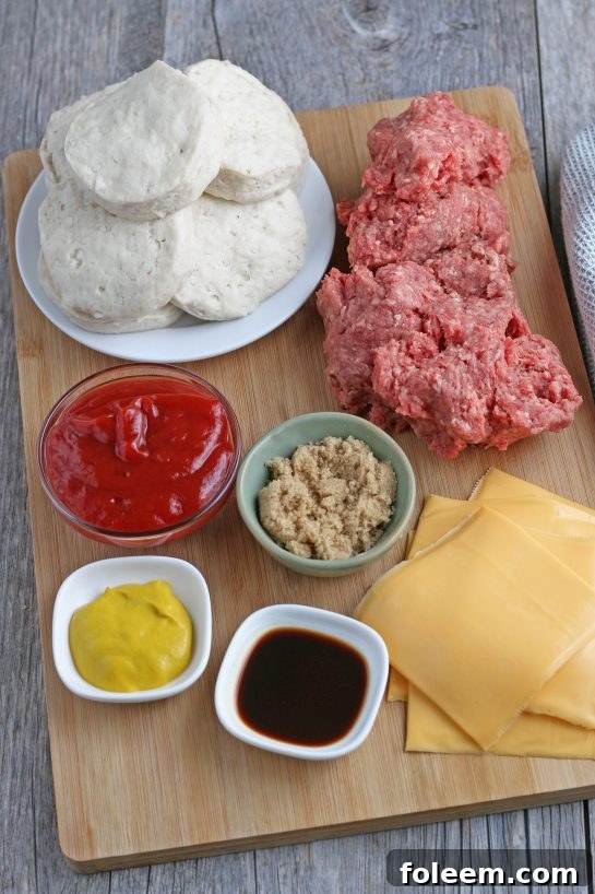 All the fresh ingredients for making delicious cheeseburger biscuit cups laid out and ready to be combined.