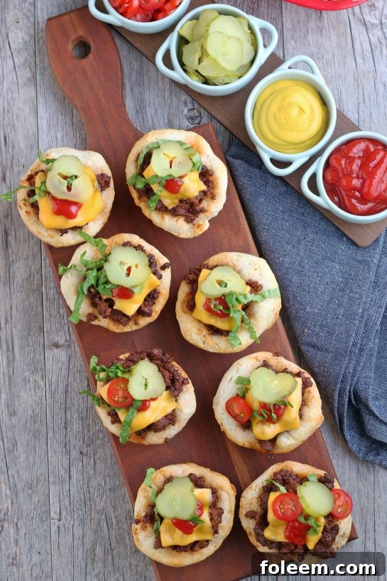 A top-down view of a golden tray of cheeseburger bites, fresh from the oven, perfectly baked and ready for serving.