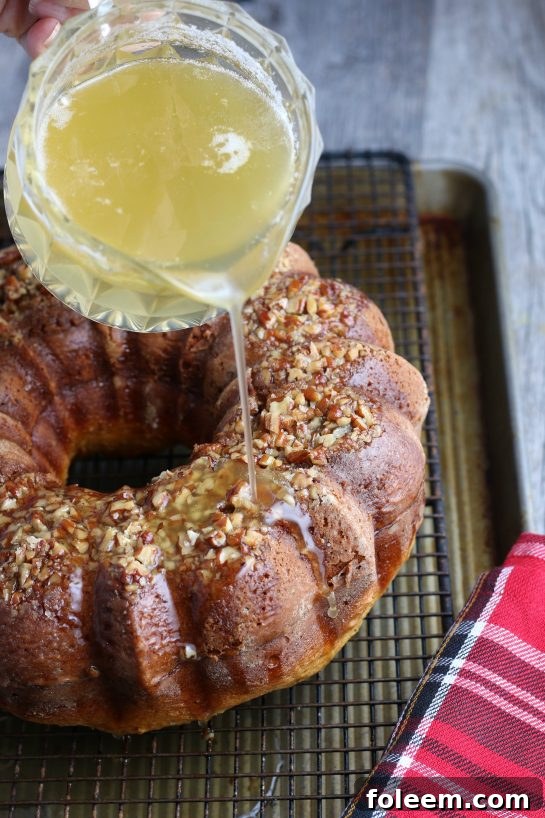 Now the rum cake glaze is being added to the rum cake!