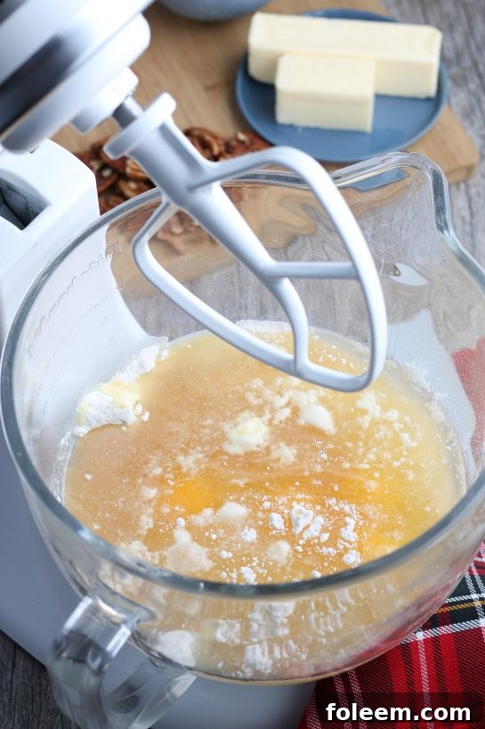 Making rum cake starts with the stand mixer and the wet ingredients.