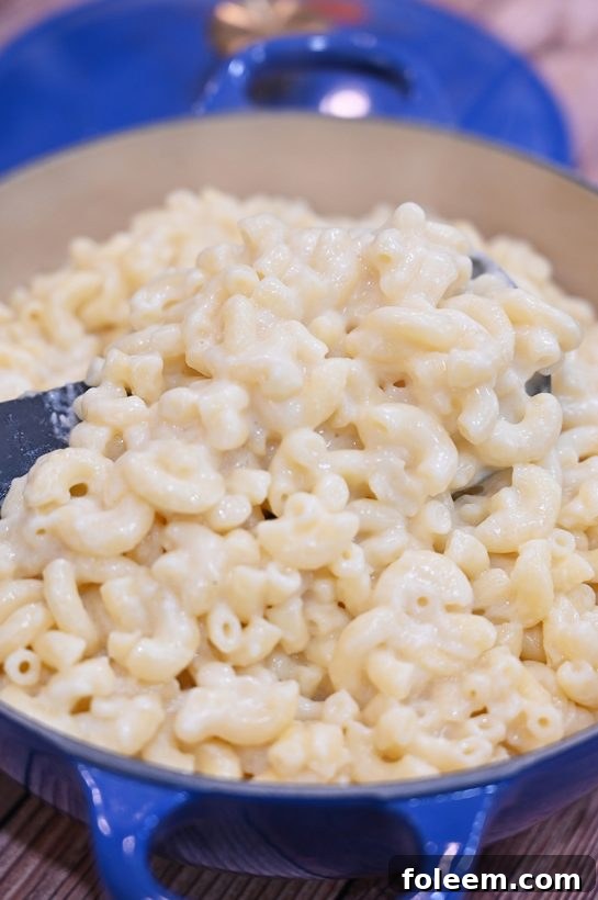 Close-up of creamy stovetop macaroni and cheese in a pot, ready to serve