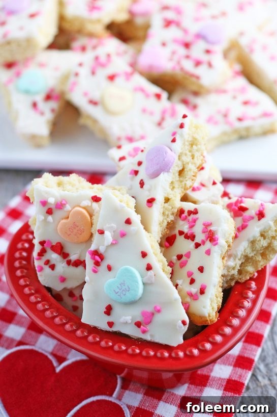 A bowl full of the conversation hearts cookie bark, broken into tempting pieces and ready to be shared and enjoyed at a gathering or as a personal treat.