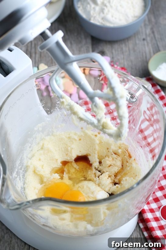 To begin we have to put our wet ingredients into the stand mixer as we begin the bark for our sugar cookie bark. The butter and sugar mixture is light and fluffy.