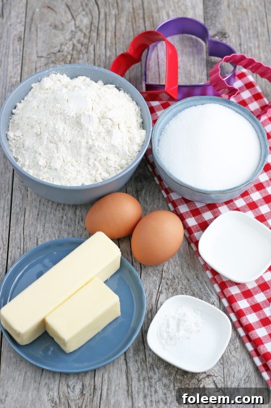 A beautifully arranged selection of all the necessary ingredients for baking homemade Valentine's cookies, ready for preparation.