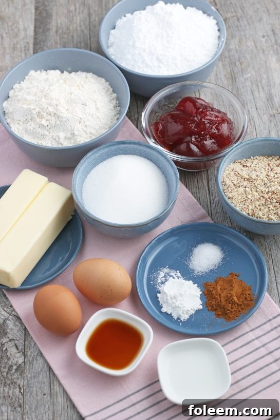 All the necessary ingredients for making Linzer cookies, neatly arranged and ready for baking.