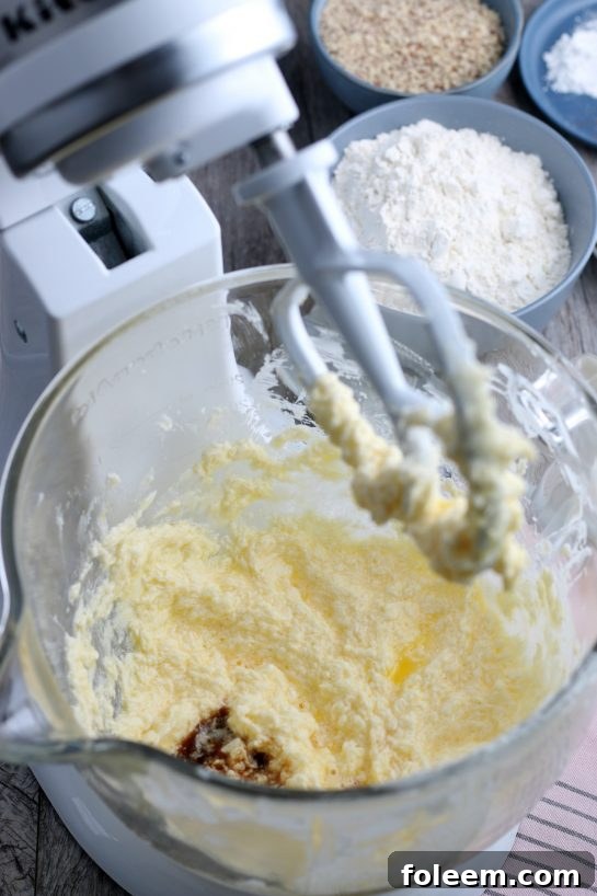 The wet ingredients for our Linzer cookies, thoroughly blended together in the stand mixer, forming the foundation of the dough.