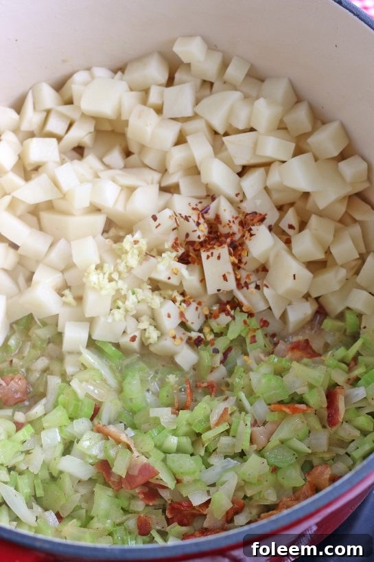 Next up we have to add the potatoes and more seasonings for this easy clam chowder recipe.