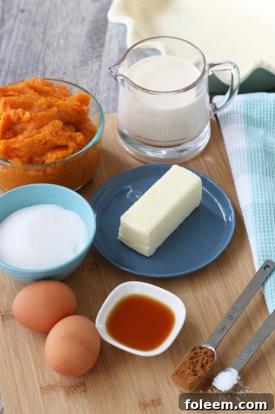 All the essential ingredients for making sweet potato pie are neatly laid out on a counter, ready for the baking process.
