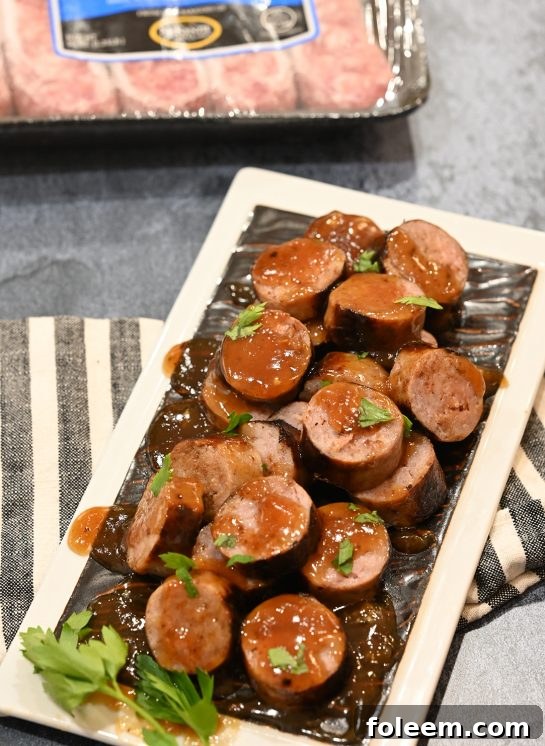 Easy Grilled Beer Brat Bites appetizer recipe for any party simmered in a malty beer sauce with soft, nearly caramelized flavor