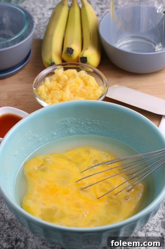 Mixing together the wet ingredients for the Homemade Hummingbird Cake