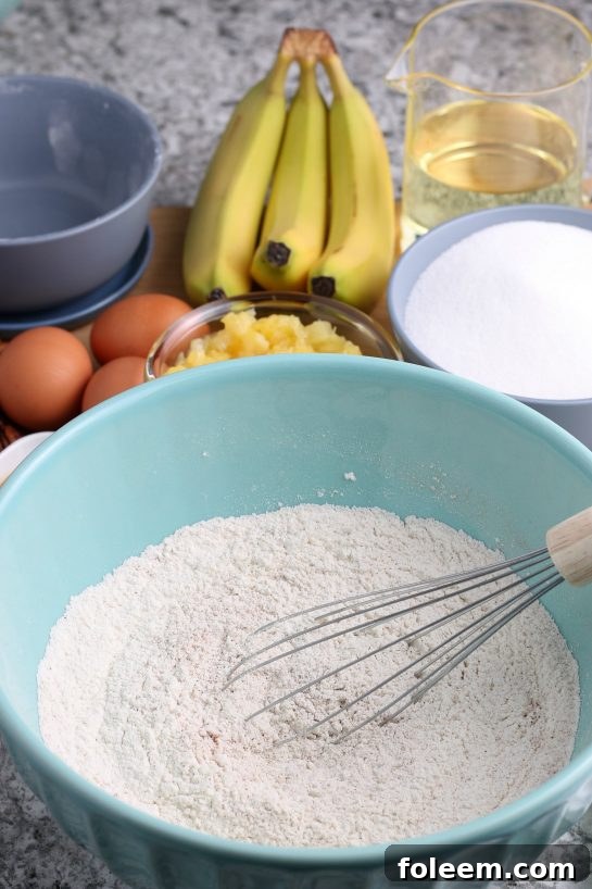 Mixing up the dry ingredients for the Homemade Hummingbird Cake recipe