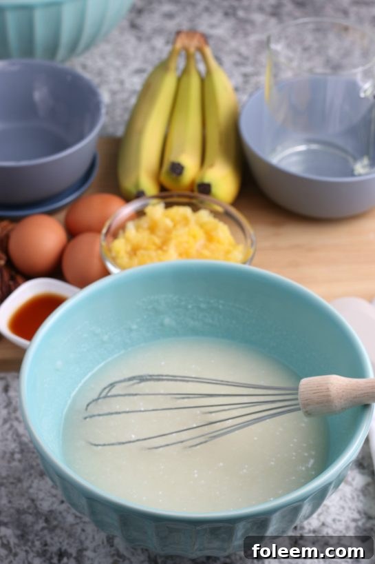 Mixing up the wet ingredients for the Homemade Hummingbird Cake recipe