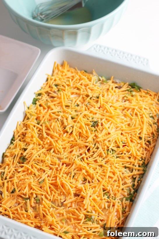 In this step we see the final toppings being added before the casserole goes into the refrigerator overnight.
