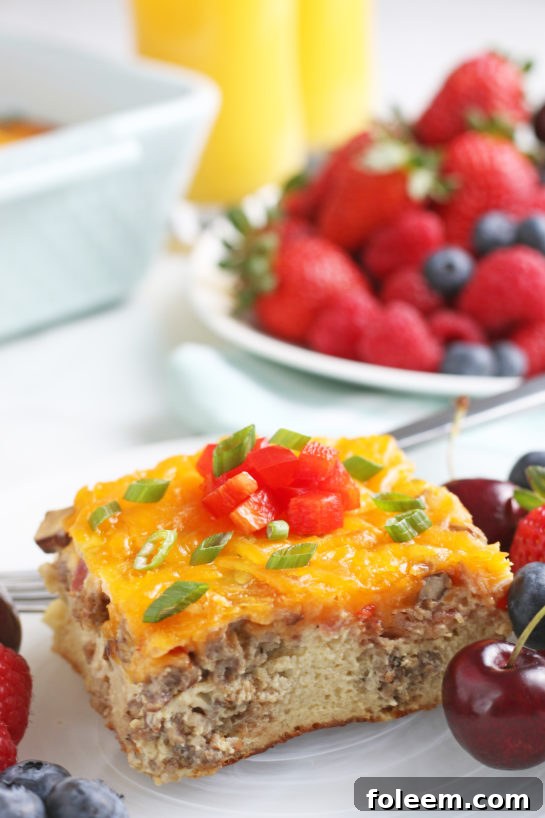 A close up shot shows us the side of this breakfast casserole egg and sausage recipe with all the delicious layers on display.