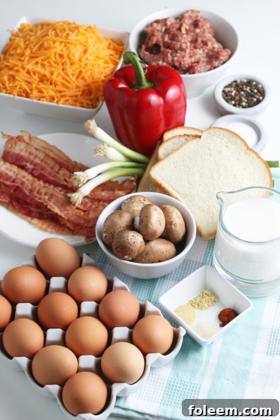 All of the ingredients needed to make a breakfast casserole egg and sausage recipe laid out before we begin.