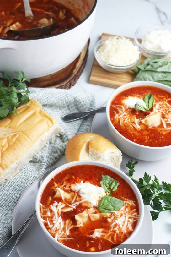 This view shows us a few bowls of the delicious and cheesy lasagna soup along with the pot full ready to be shared.