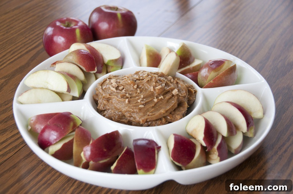 Toffee Apple Dip ready to serve with sliced apples