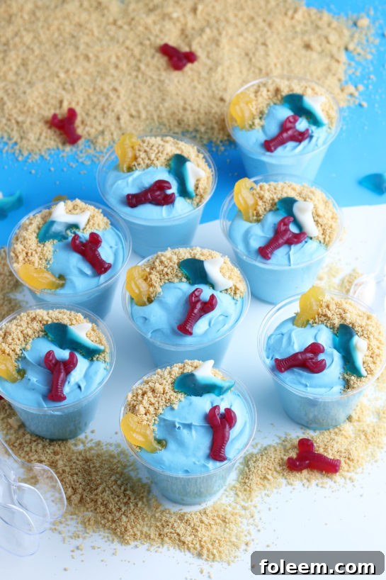 Beach Sand Pudding Cups are an adorable and oh-so-delicious no-bake dessert recipe for kids! Made with vanilla pudding, food coloring, and whipped topping they are the cutest snack for a party or snack!