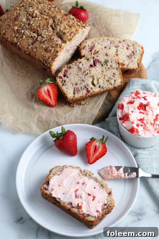An irresistible slice of strawberry and cream bread, thickly spread with luscious homemade strawberry cream cheese, tempting every taste bud.