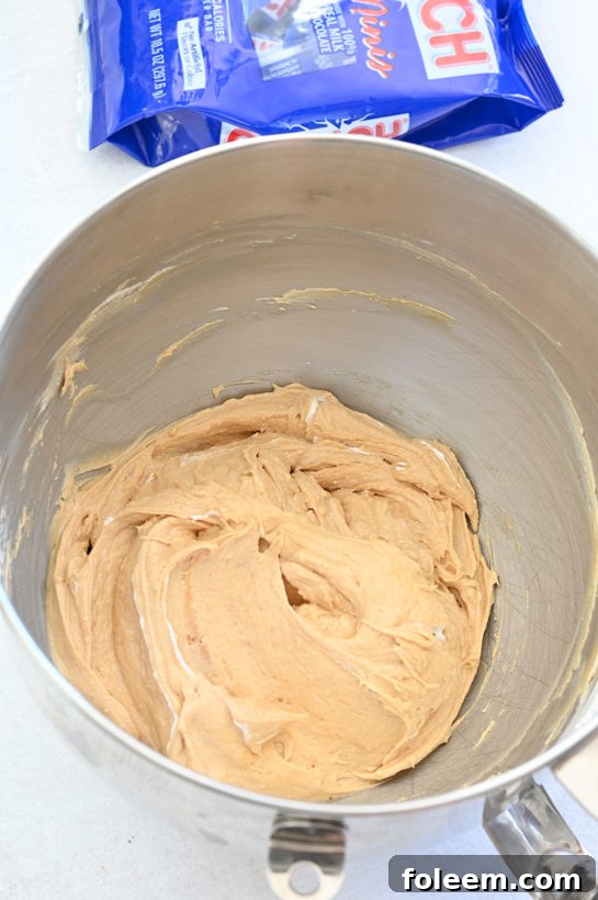 The peanut butter, whipped topping, and cream cheese all blended for the Peanut Butter Crunch Bar Dip recipe