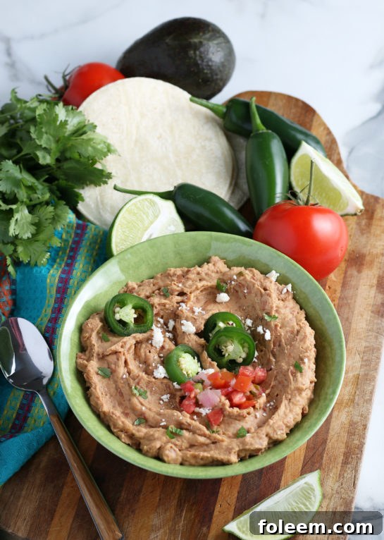 A bowl of creamy, delicious homemade refried beans ready to be served.