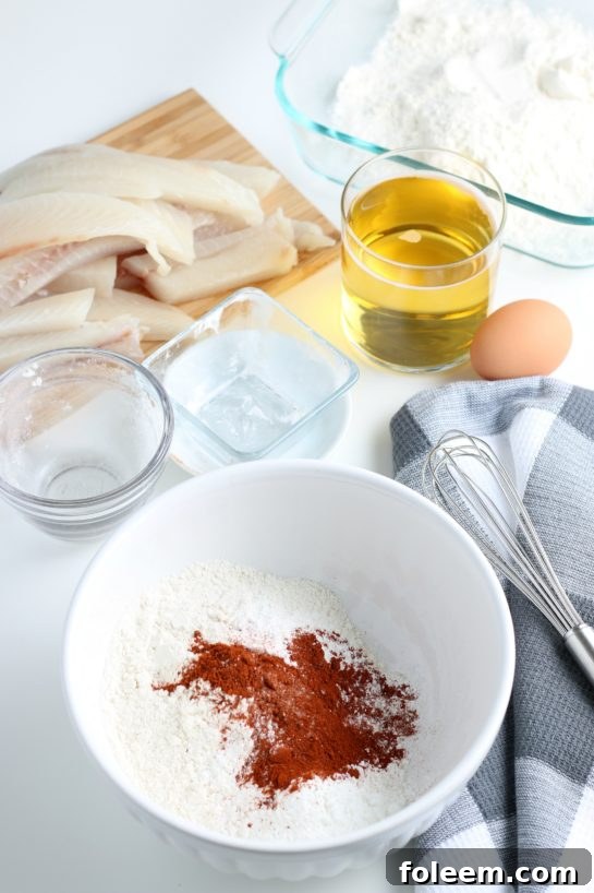 Mixing dry ingredients in a bowl to create the foundation for the beer batter