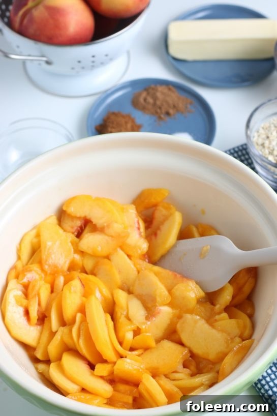 Stirring together the prepared peach filling ingredients in a large bowl