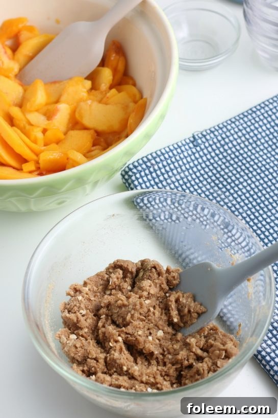 Mixing the crumble topping ingredients with oats and spices until well combined