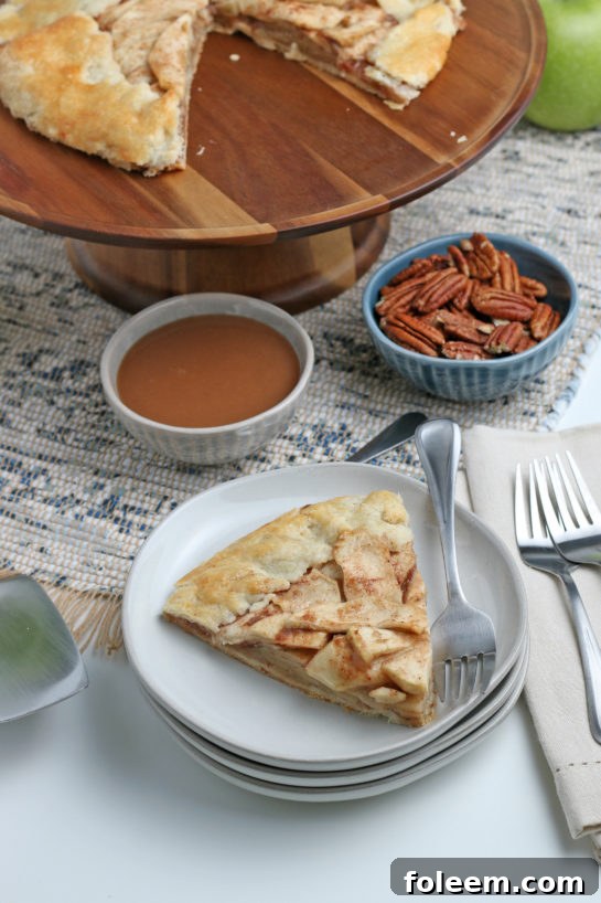 Easy Apple Crostata recipe is a simple, rustic tart filled with sweet apple filling and is one of our favorite new ways to enjoy one of your favorite fall fruit!