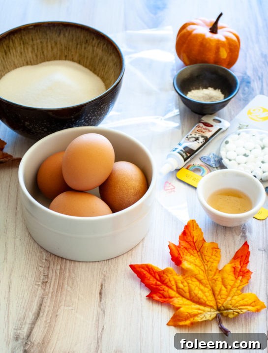 All ingredients for Halloween Boo Meringues are prepped and ready for mixing, showing egg whites in a bowl.