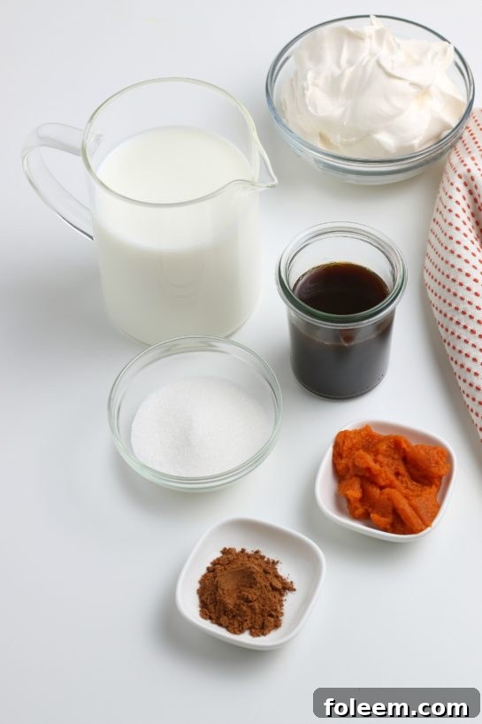 Essential ingredients laid out for preparing a delicious Homemade Pumpkin Spice Latte recipe