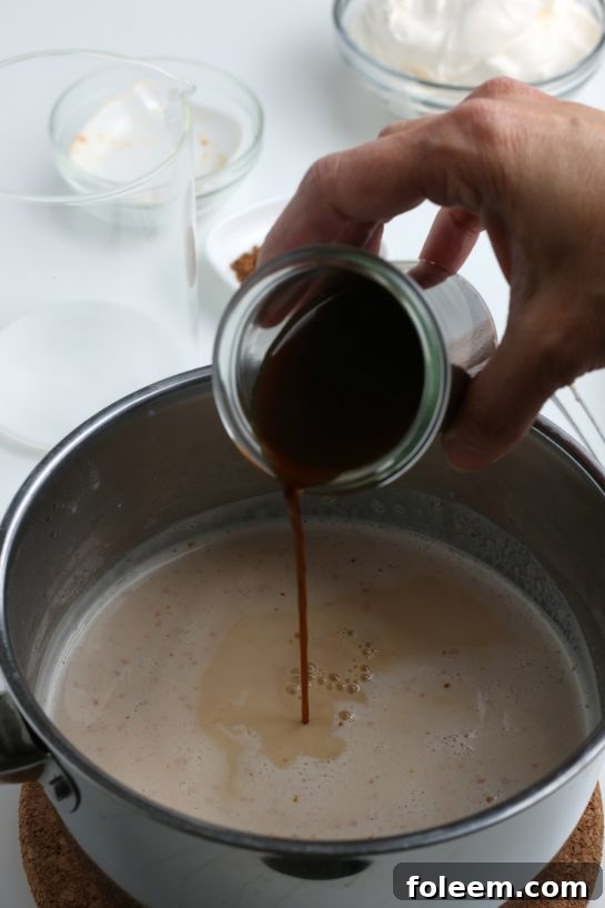 Incorporating freshly brewed coffee or espresso into the pot, completing the essential blend for a Homemade Pumpkin Spice Latte