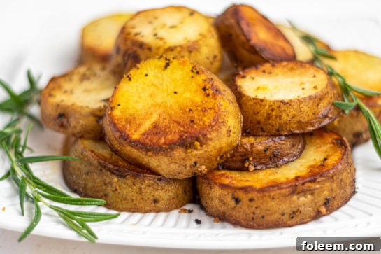 Individual serving of melting potatoes garnished with fresh herbs, ready for dinner