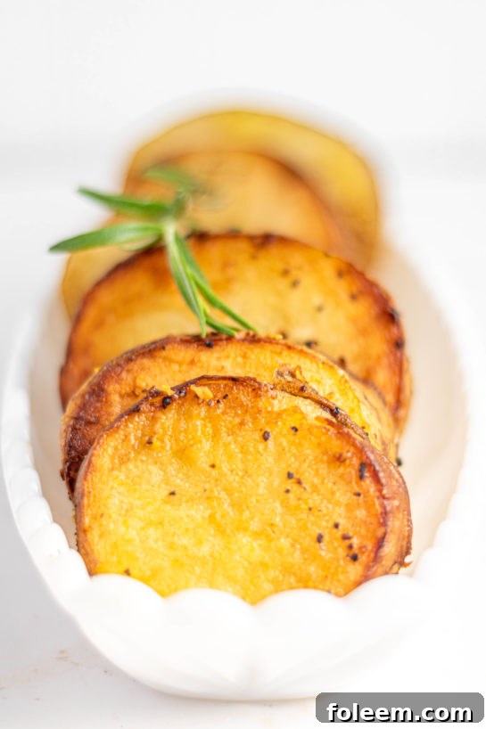 A large pan of melting potatoes, showcasing their golden crust and tender appearance