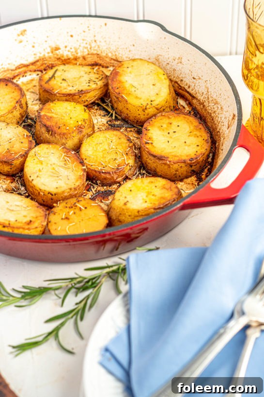 Hearty serving of melting potatoes in a skillet, perfect for Thanksgiving or Christmas dinner