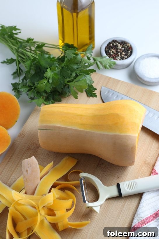 Peeling the butternut squash for the roasted butternut squash recipe