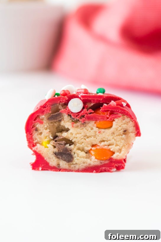 Close-up of Christmas Edible Cookie Dough Balls recipe is so easy to make, made with no eggs, and especially perfect for holiday dessert trays!