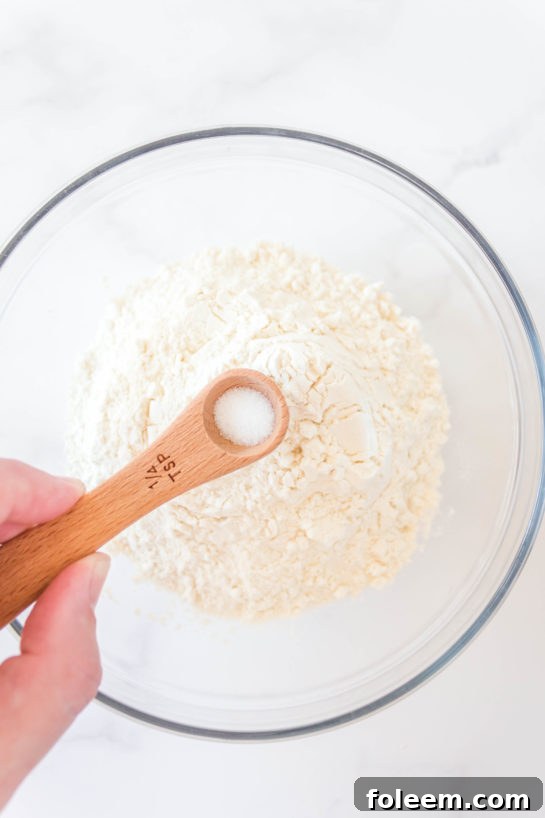 Adding the dry ingredients needed for Edible Cookie Dough Bombs recipe